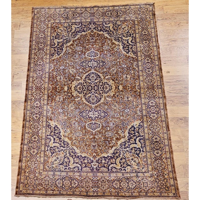 A beautifully crafted mid-20th century Turkish silk area rug of quiet luxury and refinement, featuring a delicate floral...
