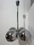 Space-Age chandelier in chromed metal with four lights, in the style of Reggiani, 1970 Adjustable height, E14 bulbs....