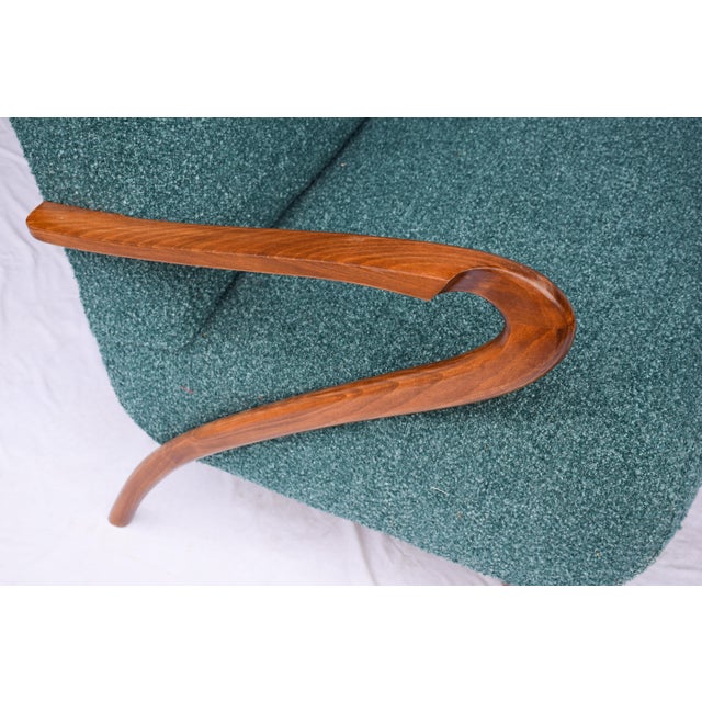 Explore the elegance of this Italian mid-century style settee. Upholstered in a Teal/Green/Blue nubby bouclé fabric....