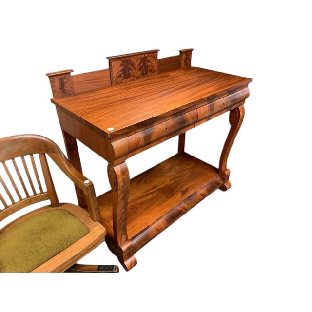 The Empire Style Mahogany Server is a stunning antique piece that exudes elegance and charm. This sideboard/buffet...
