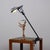 Table lamp with clamp, in enamelled metal and aluminium. This piece is attributed to the mentioned designer/maker. It has...