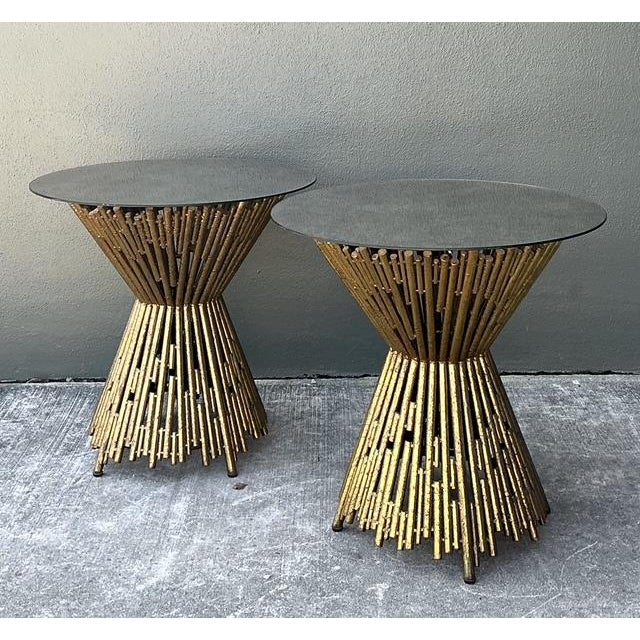 Add a touch of sculptural drama to your living space with this striking pair of "Pick Up Stick" side tables by the...