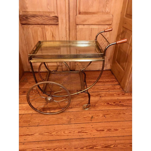 Swedish Art Deco Style Brass Bar Cart attributed to Josef Frank for Svenskt Tenn, 1950s, in Very Good conditions. Designed...
