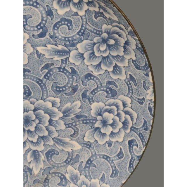 Experience the elegance of Japanese craftsmanship with this vintage blue and white porcelain serving plate, beautifully...