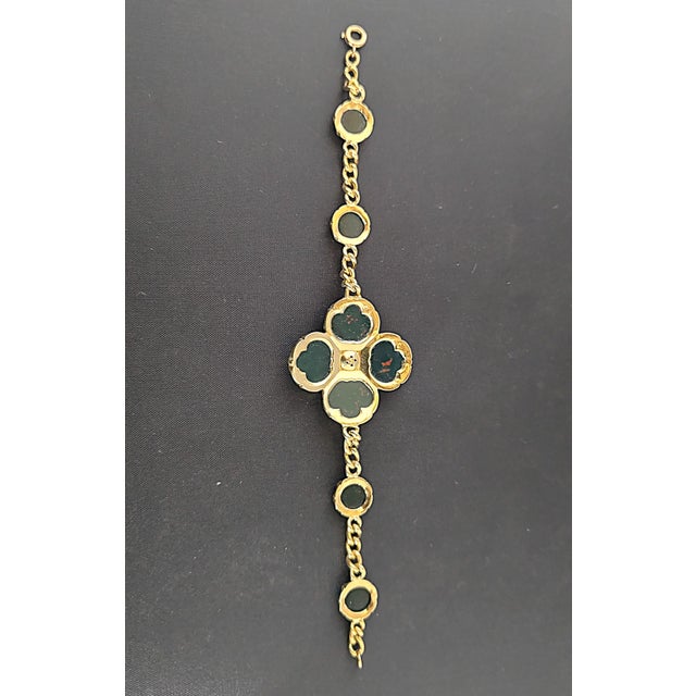 Superb and rare 19th-century bracelet in 18-karat yellow gold with four cabochon heliotrope jasper stones in the shape of...