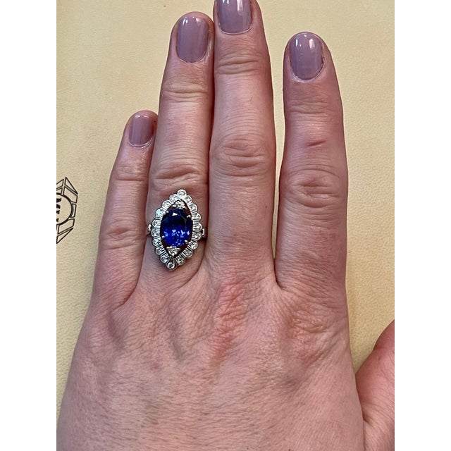 Blue 3.65 Carat Oval Tanzanite and 1 Carat Diamond Ring 18 Karat White Gold, Estate For Sale - Image 8 of 18