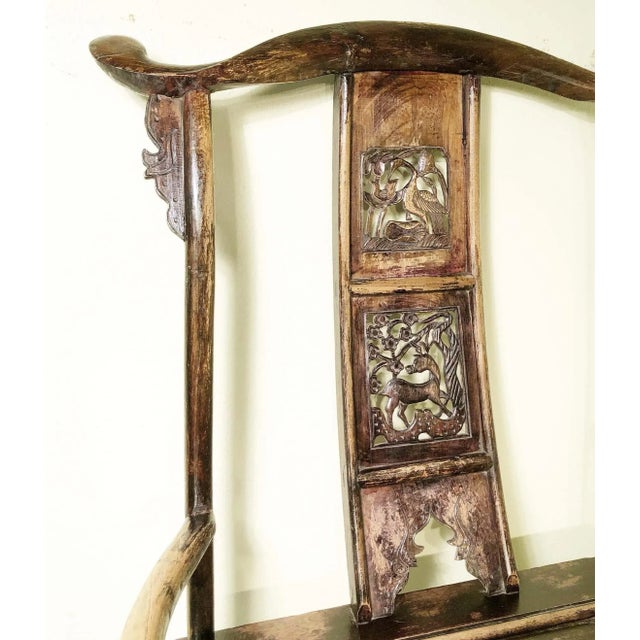 This style of chair is known as "official's hat chair" because the projections over the rear stiles resemble the knobs on...