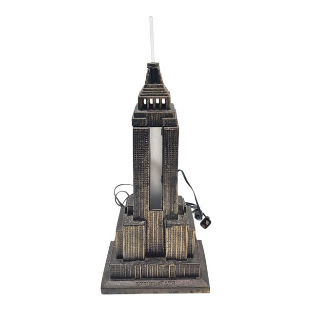 A monument in miniature, lit from within like a dream remembered. This sculptural lamp by Sarsaparilla renders the Empire...