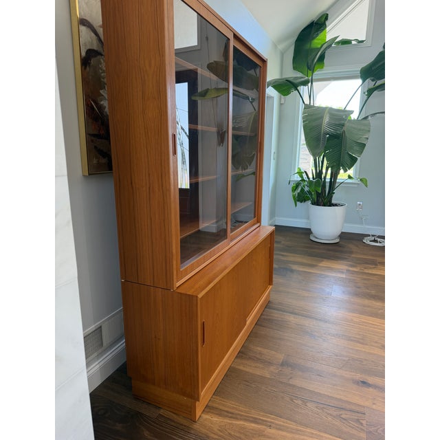 A handsome and exceptionally functional Danish Modern teak bookcase and display cabinet by Poul Hundevad, Denmark....