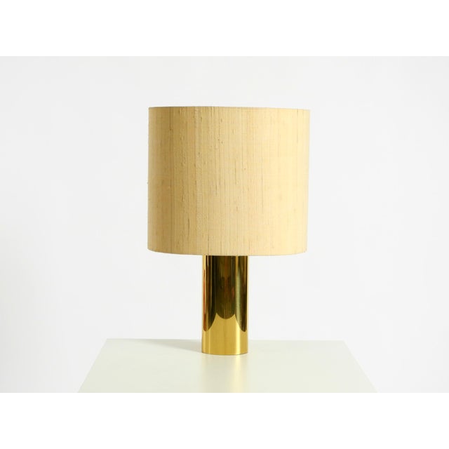A very rare, large, and heavy 1970s brass table lamp with a wild silk shade. manufacturer: vereinigte werkstätten....
