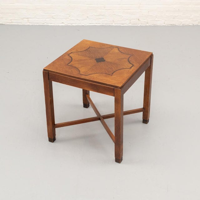 Art Deco / Amsterdam School side table from the 1920s–30s, crafted in oak with a striking inlaid tabletop using...