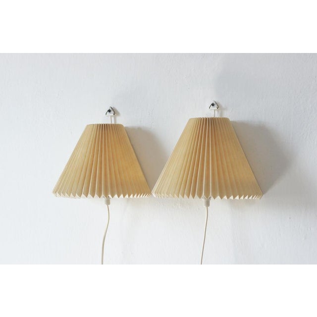 The pair of Model 203 wall lamps designed by Hennig Seidelin for Le Klint is an absolute classic of Danish...