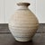 This beautiful Vintage Studio Pottery Vase brings a minimalist yet artistic charm to your space. With its natural speckled...