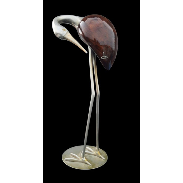 An elegant decorative sculpture depicting a stylized heron, created in the 1960s by De Stijl Florence. The work fully...