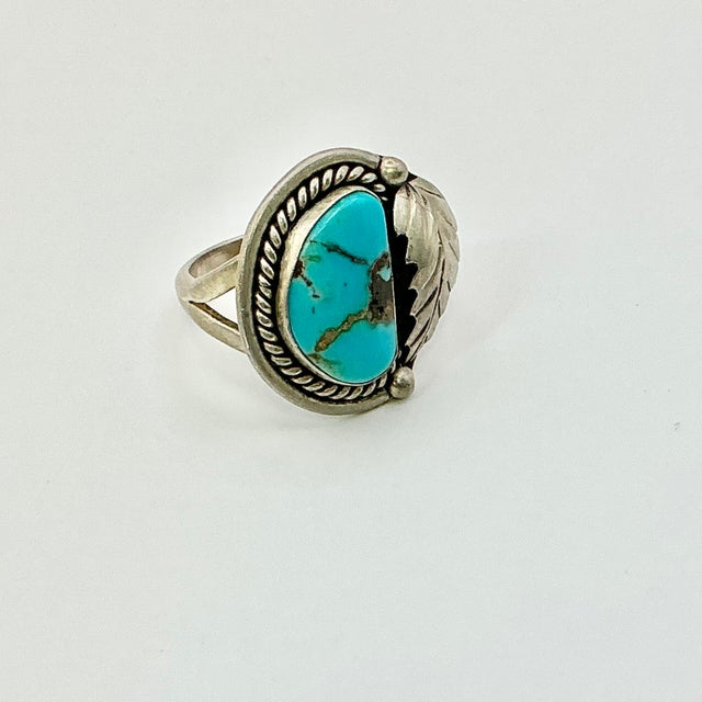 Vintage Home is pleased to present this gorgeous sterling silver cocktail ring with a Turquoise stone and sterling leaf...