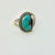 Vintage Home is pleased to present this gorgeous sterling silver cocktail ring with a Turquoise stone and sterling leaf...