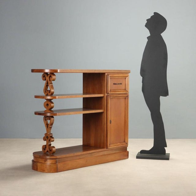 Renaissance style balustrade cabinet, crafted in the 20th century, made of walnut wood. The design features an upper shelf...