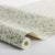 Inspired by an archival pattern, Boråstapeter Klöver features dainty clover flowers nestled among softly layered leaves,...