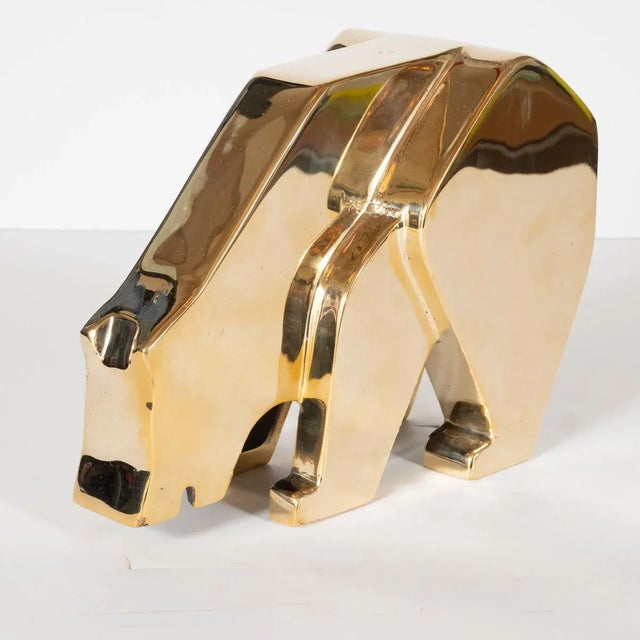 Modernist bear sculpture composed of solid, polished brass.
