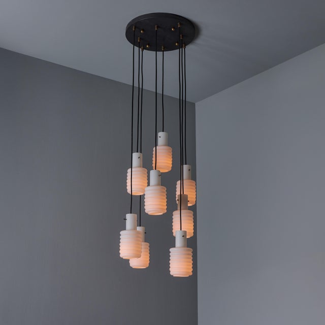 1950s Italian 8-Shade Cascading Chandelier Attributed to Arredoluce. An extremely refined design executed in sculptural...