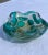 This is a vintage murano art glass bowl. The entire vessel of the bowl is done in an organic shape and thick clear glass....