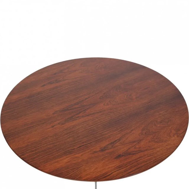Arne Jacobsen coffee table with a table top of rosewood and a base of aluminium. The table is from 1963 but has been...
