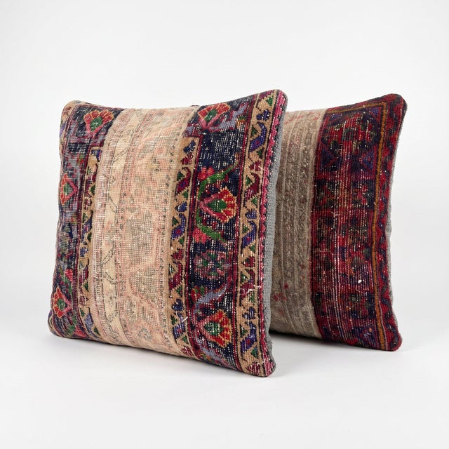 This 24'' x 24'' pillow cover set was made from authentic Turkish rug pieces — rich burgundy tribal bands with ivory...