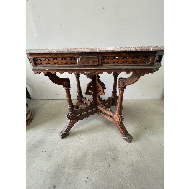 Bring late 19th-century elegance into your space with this exceptional American Victorian Eastlake center parlor table,...