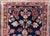 A gorgeous early 20th century Persian Sarouk rug with a central medallion surrounded by a mirrored floral pattern with...