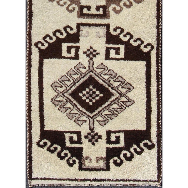 Turkish Tulu vintage runner in dark brown tones with tribal medallion design. Keivan Woven Arts / rug en-176280, country...