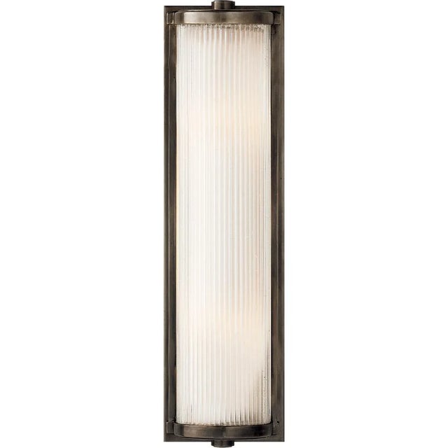 Dresser Long Glass Rod Light in Bronze with Frosted Glass Liner Designer: Thomas O'Brien Height: 18" Extension: 3.5"...