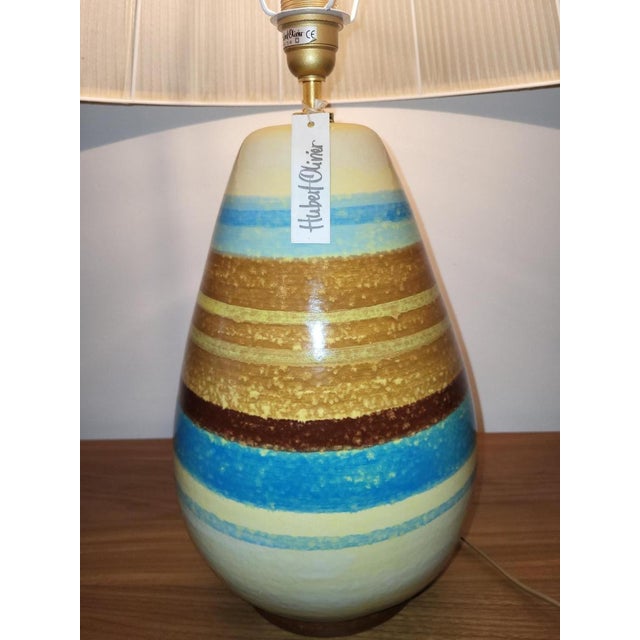 This decorative lamp from the manufacturer Hubert Olivier is much more than just a light source; it's a true work of art....