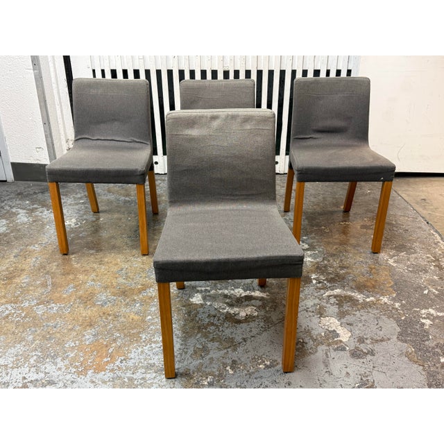 Design Plus Gallery presents a Set of Four Knicker Chairs by Blu Dot. The Knicker Chair pairs gray upholstered seating...