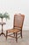 This antique petite walnut accent chair features a hand-tied cane seat and back, set against a rich patinaed walnut frame,...