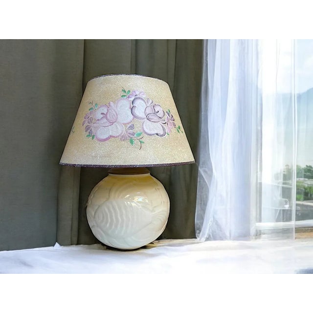 Vintage Ceramic Table Lamp White glossy table lamp with fantasy fish relief and hand-painted plastic lampshade. Made in...