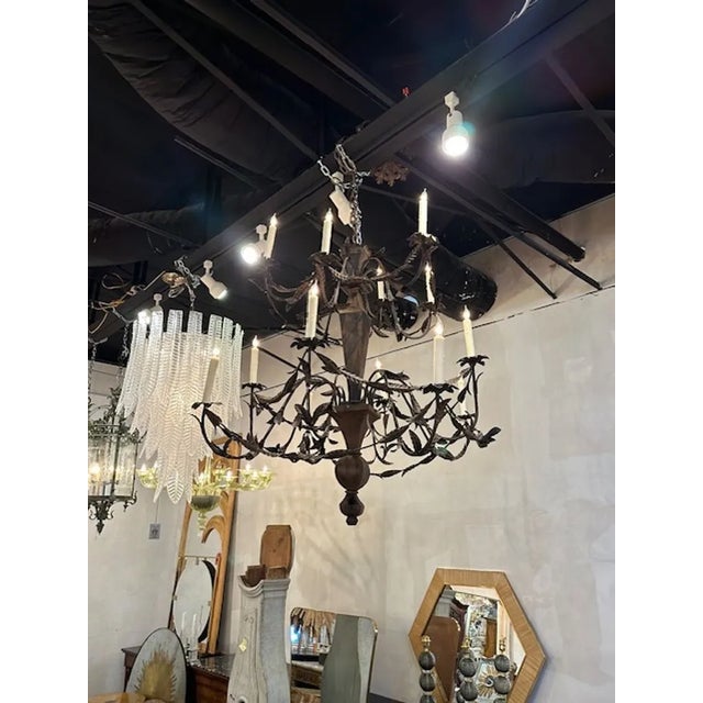 Late 19th century Italian wood and iron 14-light chandelier from Rome. Circa 1890. The chandelier has been professionally...