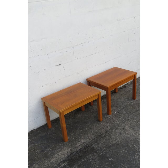 This gorgeous Pair of Side Tables is made out of wood, teak wood, and veneer. The Tables were made in Denmark, Inform...
