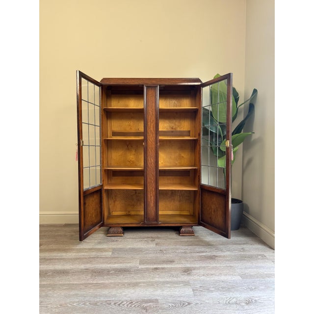 A beautiful large vintage display drinks cabinet. Made from wood and glass with solid wooden shelves, these are able to be...