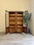 A beautiful large vintage display drinks cabinet. Made from wood and glass with solid wooden shelves, these are able to be...