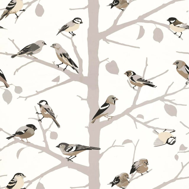 A forest of silhouetted trees provides a graphic backdrop for a colorful flock of songbirds in this charming screen-...
