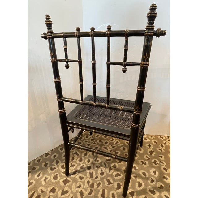 Just in , this charming French Napoleon III Ebonized Faux Bamboo Painted Low Chair, with a cane seat. This chair is what...