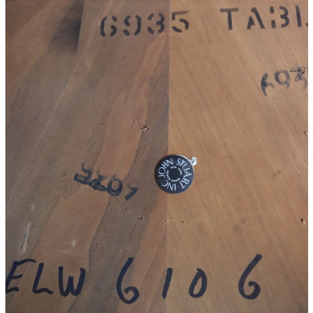 Louis XV style dining table with scalloped edges and cabriole legs in cream finish with fruitwood marquetry top. Comes...