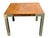 Olive burl side table with brass legs in the style of Milo Baughman. Striking Mid-Century Modern table is veneered with...