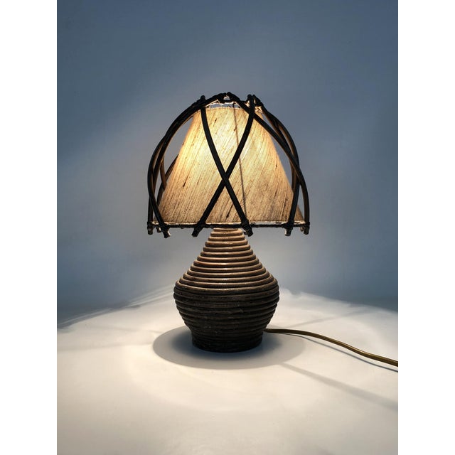 Bamboo Rattan Bedside Lamp attributed to Louis Sognot, 1950s, in Very Good conditions. Designed 1950 to 1959 This piece is...