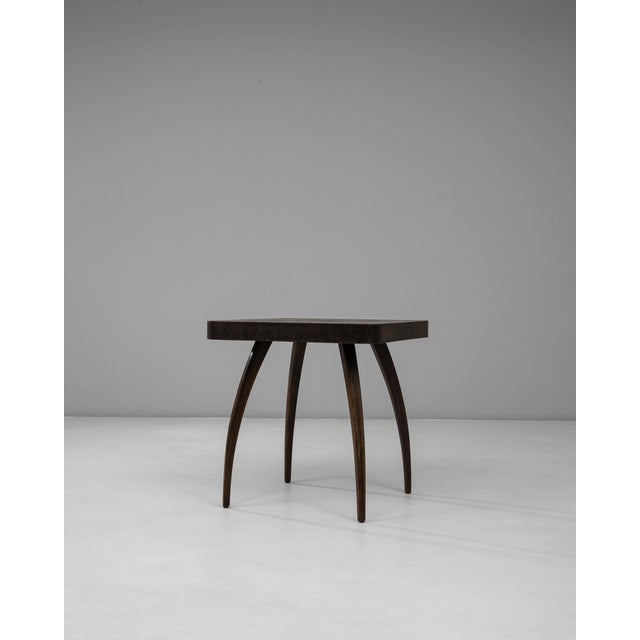 This 1960s Czech black patinated spider table by J. Halabala is an iconic example of the designers sculptural approach to...