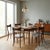 Six vintage Italian-made dining chairs, featuring an exposed stained beechwood frame and a newly refurbished seat with...
