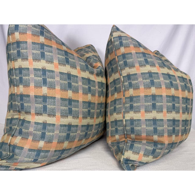 Custom pair of 22" pillows covered in Holland & Sherry "Flamestitch Plaid" in color teal. These pillows are self welted,...