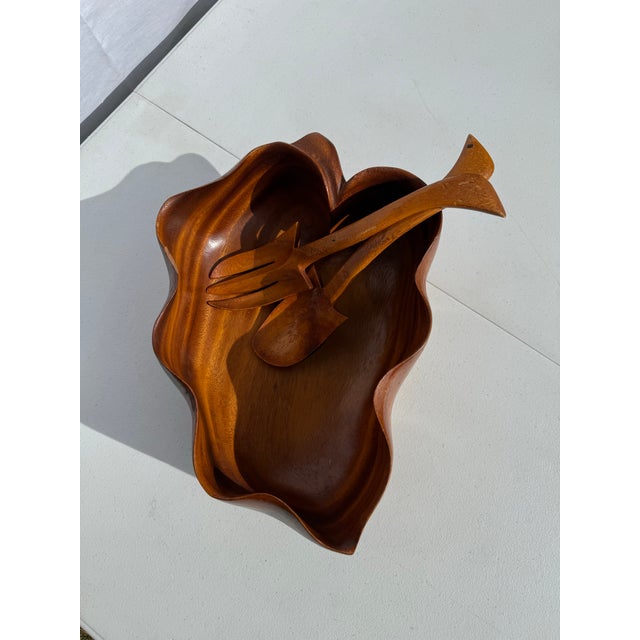 Beautiful vintage oak leaf shaped teak serving bowl. Complete with unique salad tongs. Perfect for any mid century table.