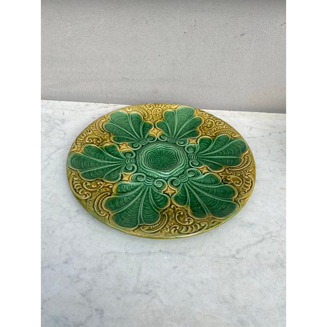 Colorful French Majolica green and yellow oyster plate with stylized leaves, circa 1890.