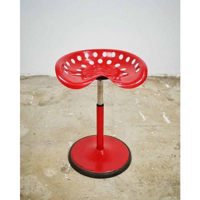 "Tractor" stool by Etienne Fermigier for Mirima. Red lacquered metal frame and seat, adjustable height. It has some marks...